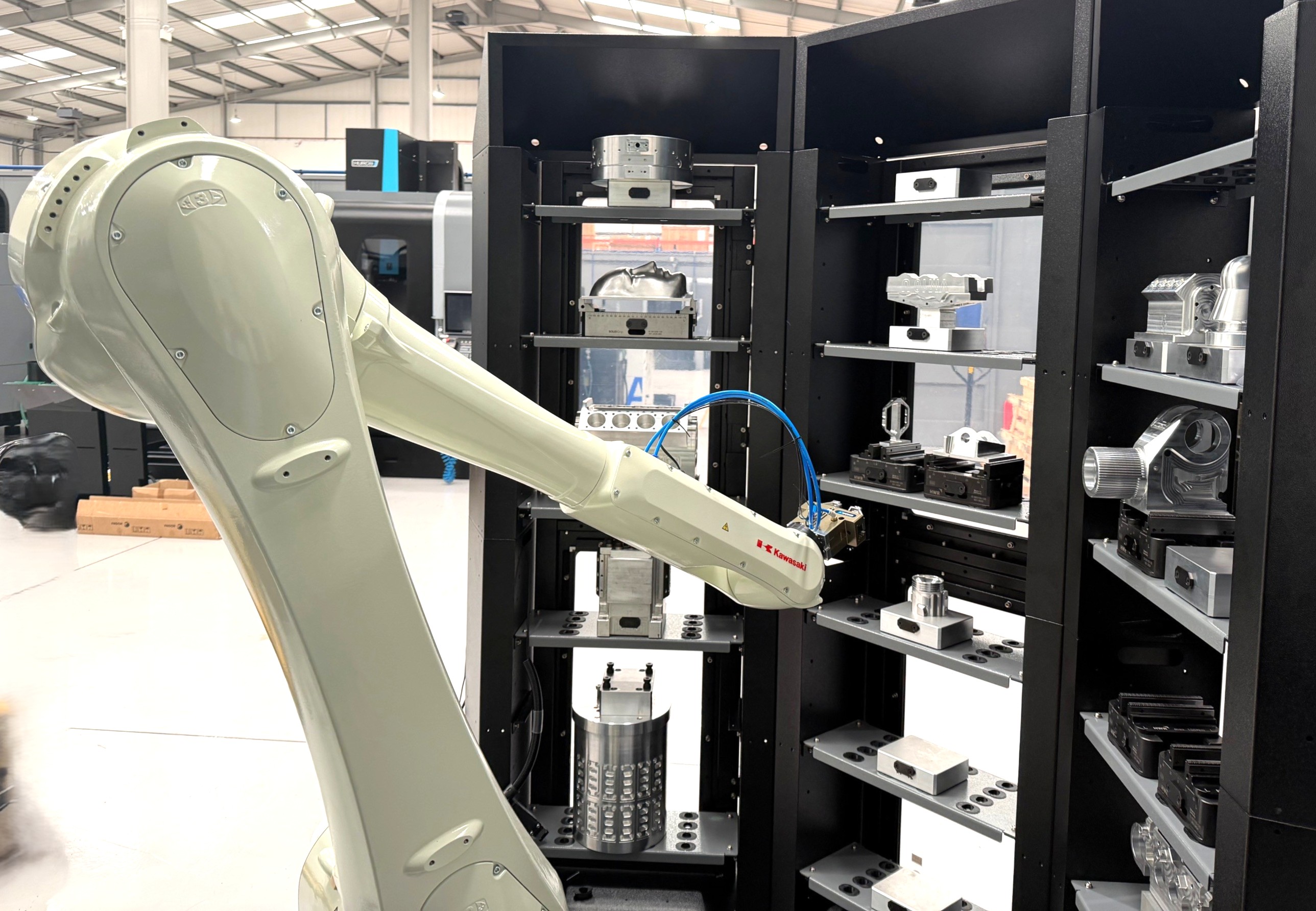 Kawasaki PC25 automation system loading a Hurco VC500i 5-axis machining centre